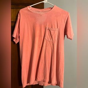 Coral color t-shirt! Has stains but it is laundry detergent and some foundation!